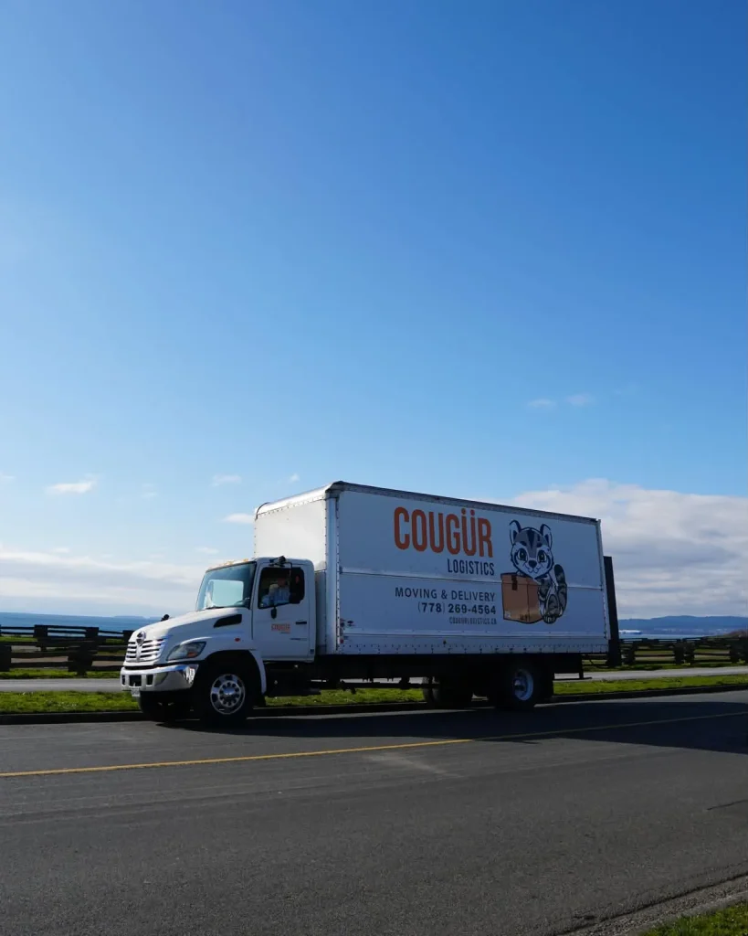 Cougur Logistics 26-foot moving truck by the ocean in Victoria, BC